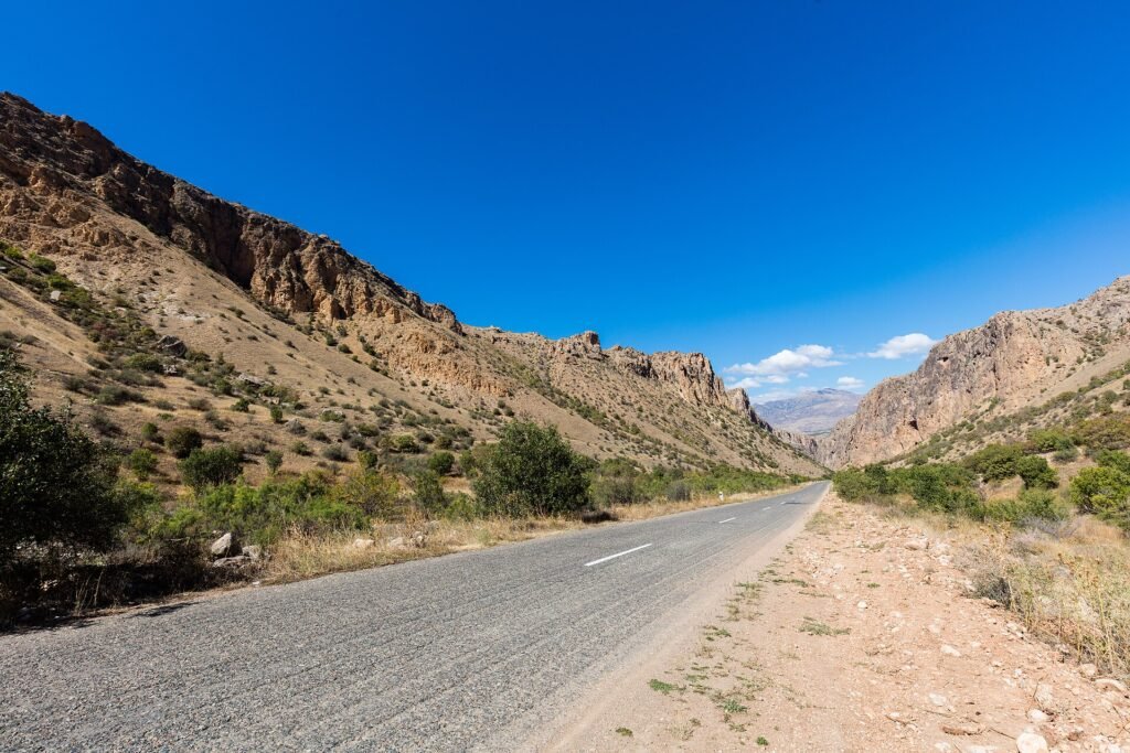 Road through the red rock canyon to Noravank, Armenia