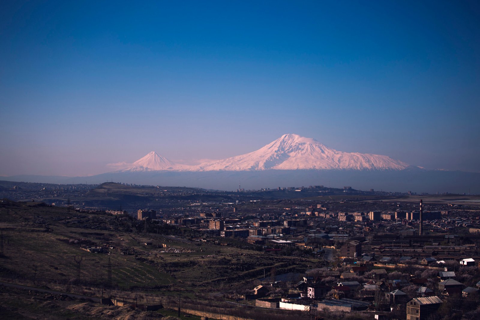Mount Ararat rising above a village in the Ararat plain of Armenia