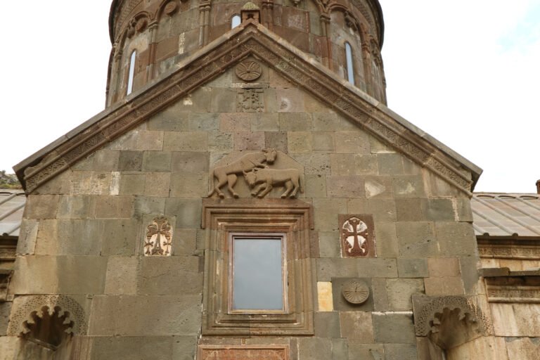 Stone carvings on the facade of Katoghike church at Geghard Monastery, Armenia