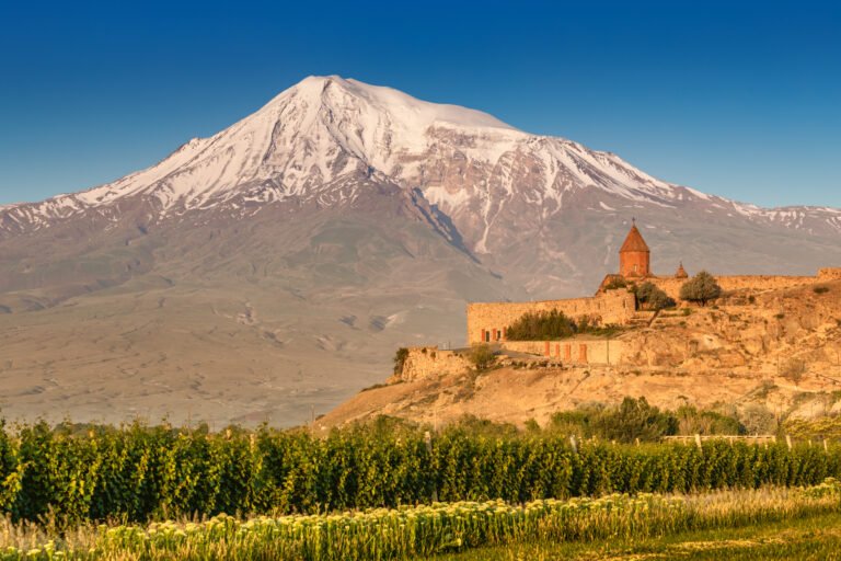 Khor Virap Monastery in Armenia with Mount Ararat glowing at sunrise