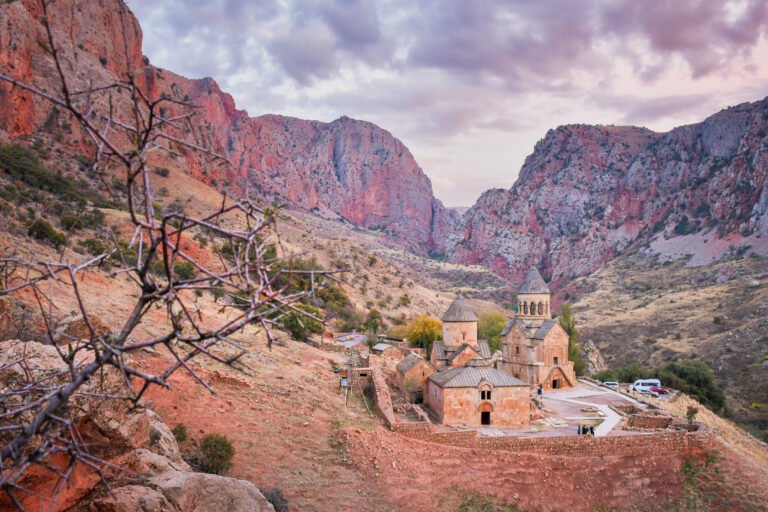 Noravank Monastery and the red cliffs of the Amaghu gorge at sunset, Armenia
