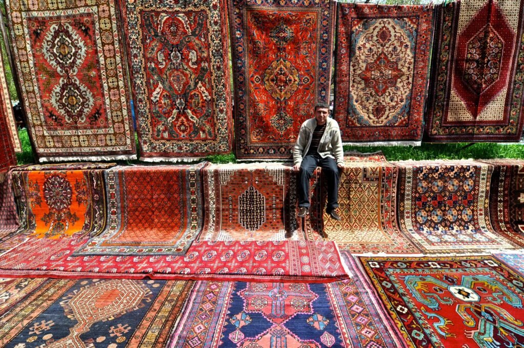 Carpets and rugs displayed for sale at the Vernissage market in Yerevan