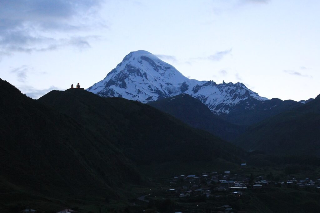 Gergeti Trinity Church with Mount Kazbek behind it, Georgia